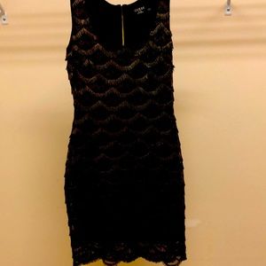 Little black dress, just below knee length
